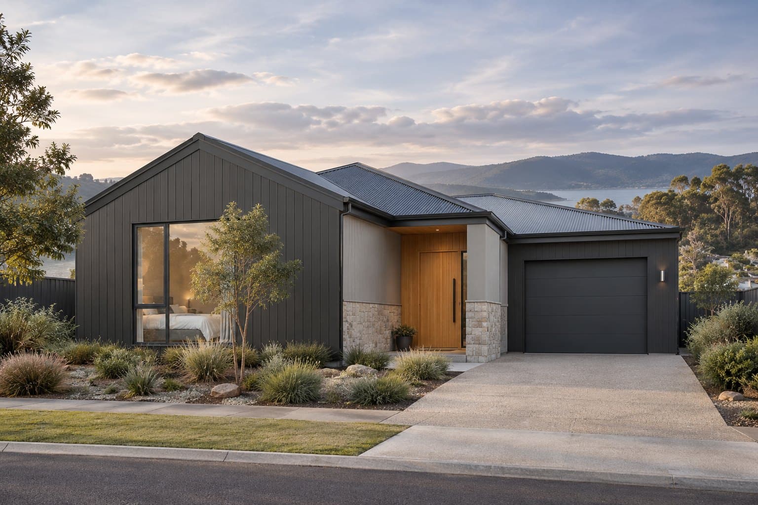 Single-storey home with dark vertical cladding, a gabled wing and a timber front door
